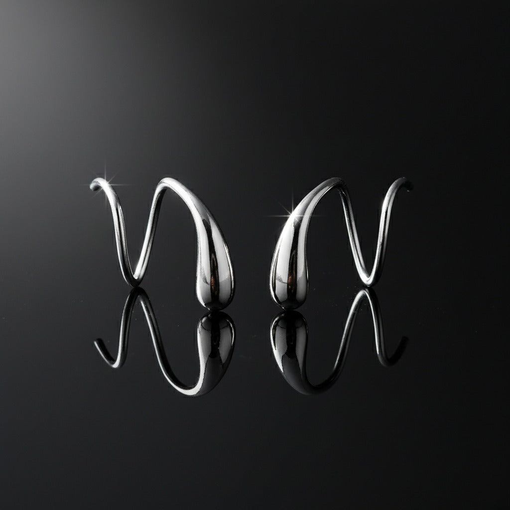 Metallic 'V' letters on a reflective black surface