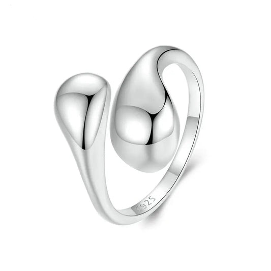 A silver-colored open design ring with a water drop shape.