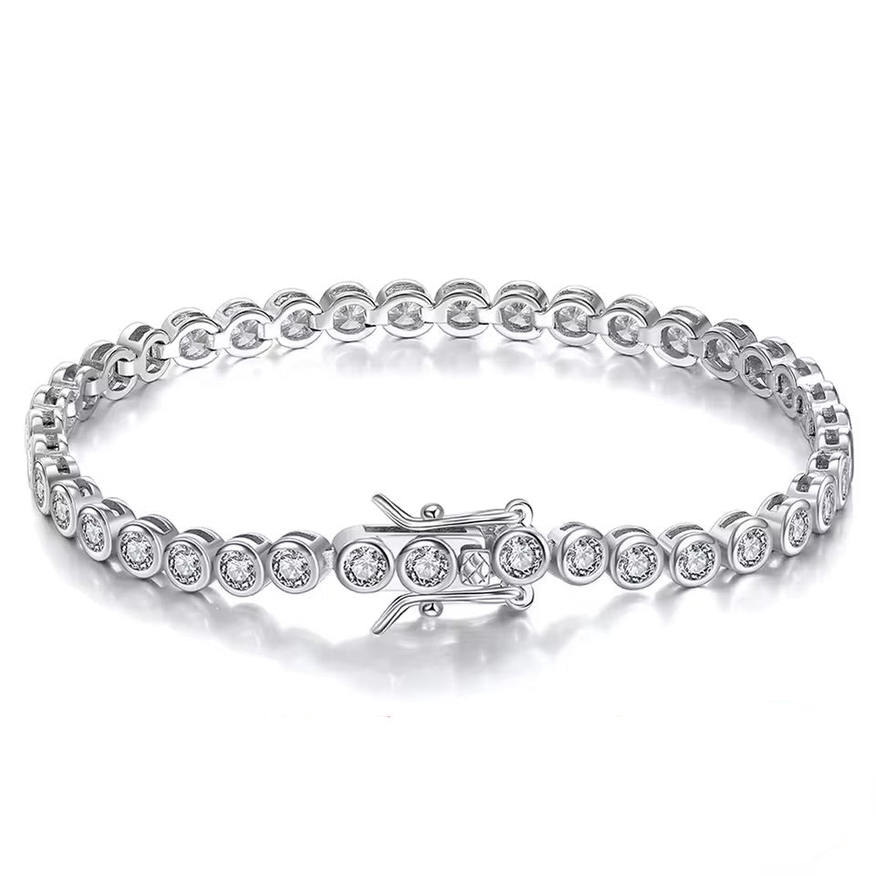 Silver bracelet with clear gemstones on a white background