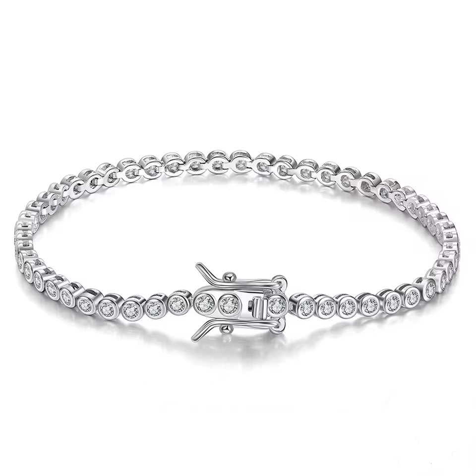 Silver bracelet with clear gemstones on a white background